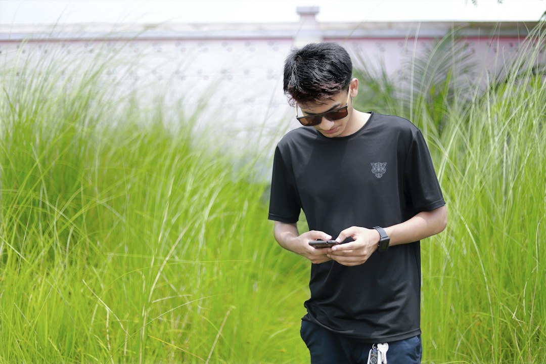 Bangladesh gamer using phone